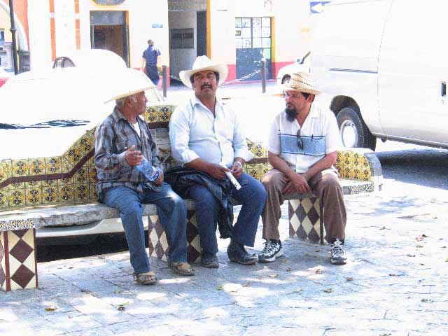 Giancoli photograph Men on Bench Talking